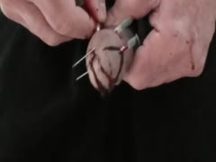 Man playing with his cock and making it bleed